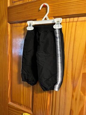 okie dokie Black track like shorts size 3-6 months with White Side Stripe